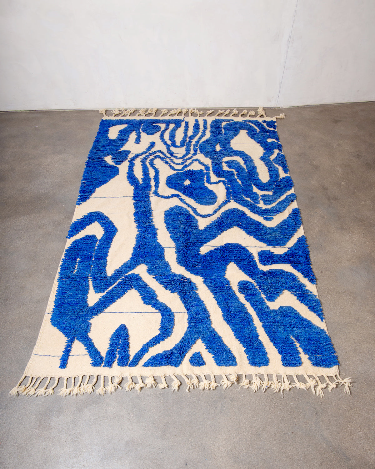 Modern, designer, handcrafted Berber rug from Morocco. Beniourain carpet with beautiful colours and patterns and fluffy wool texture.